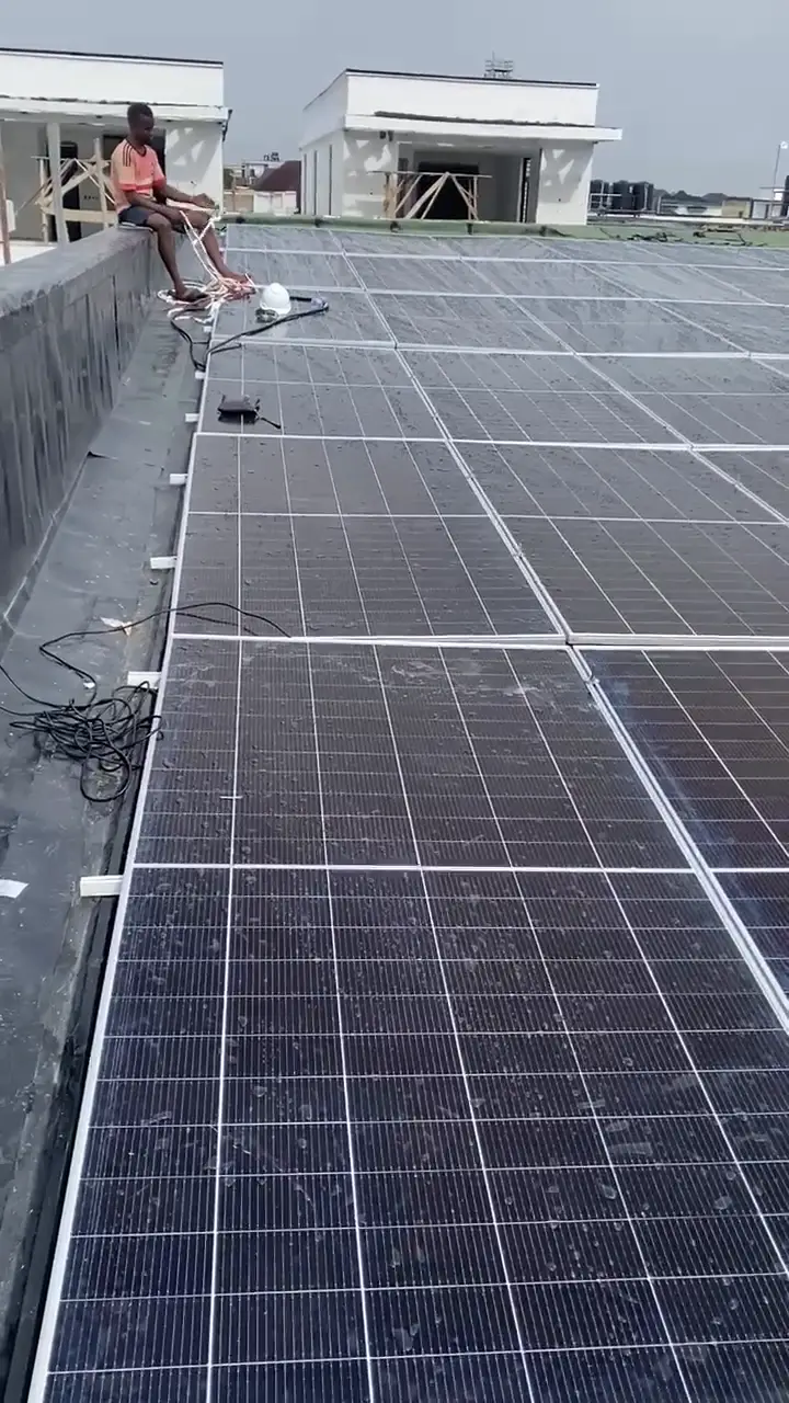 A walk along the flat roof past the full run of installed bifacial panels.