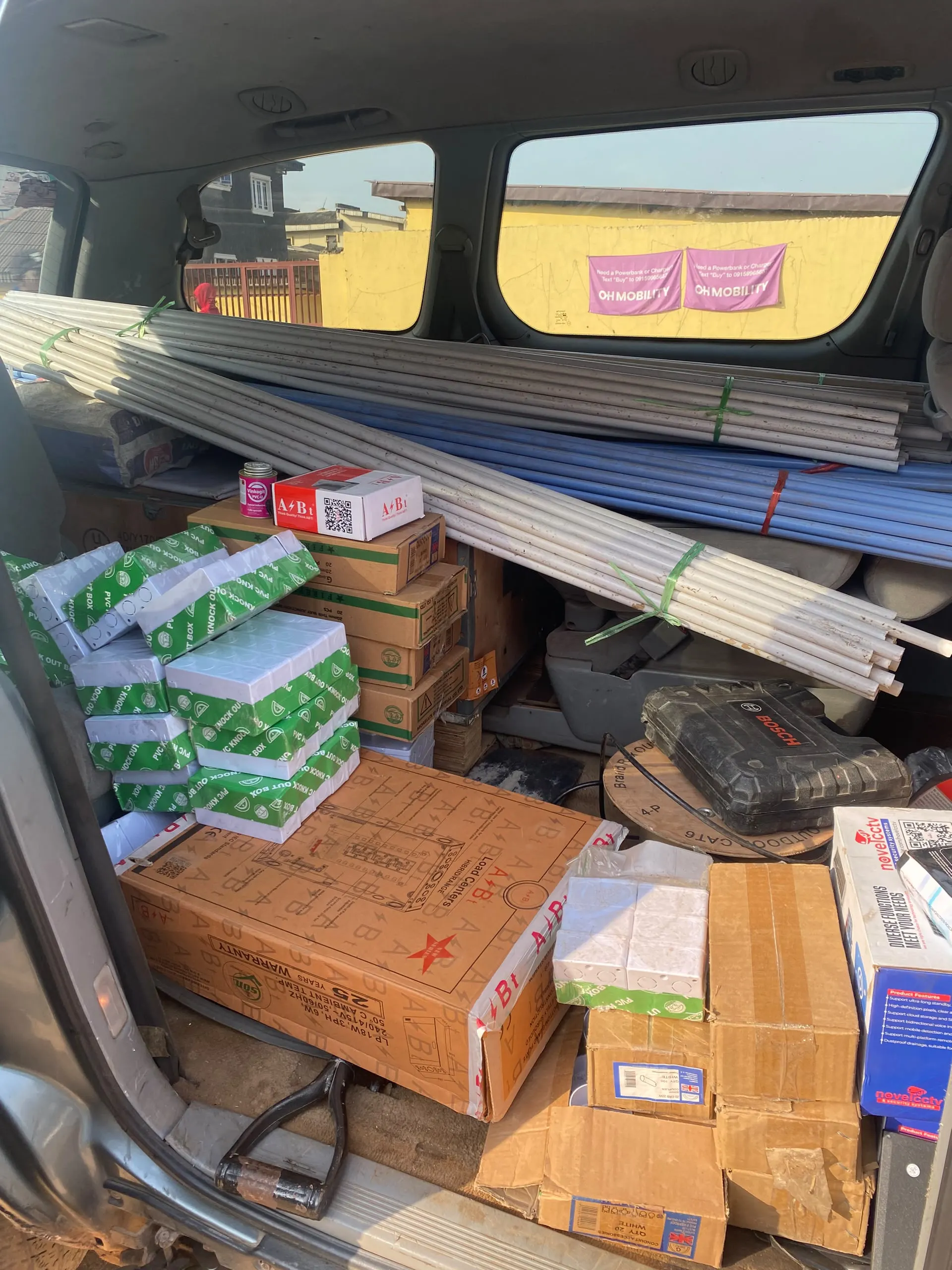 A van loaded with conduit and wiring materials for the job.