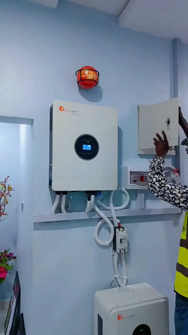 The crew mounting the inverter and setting the battery in place.