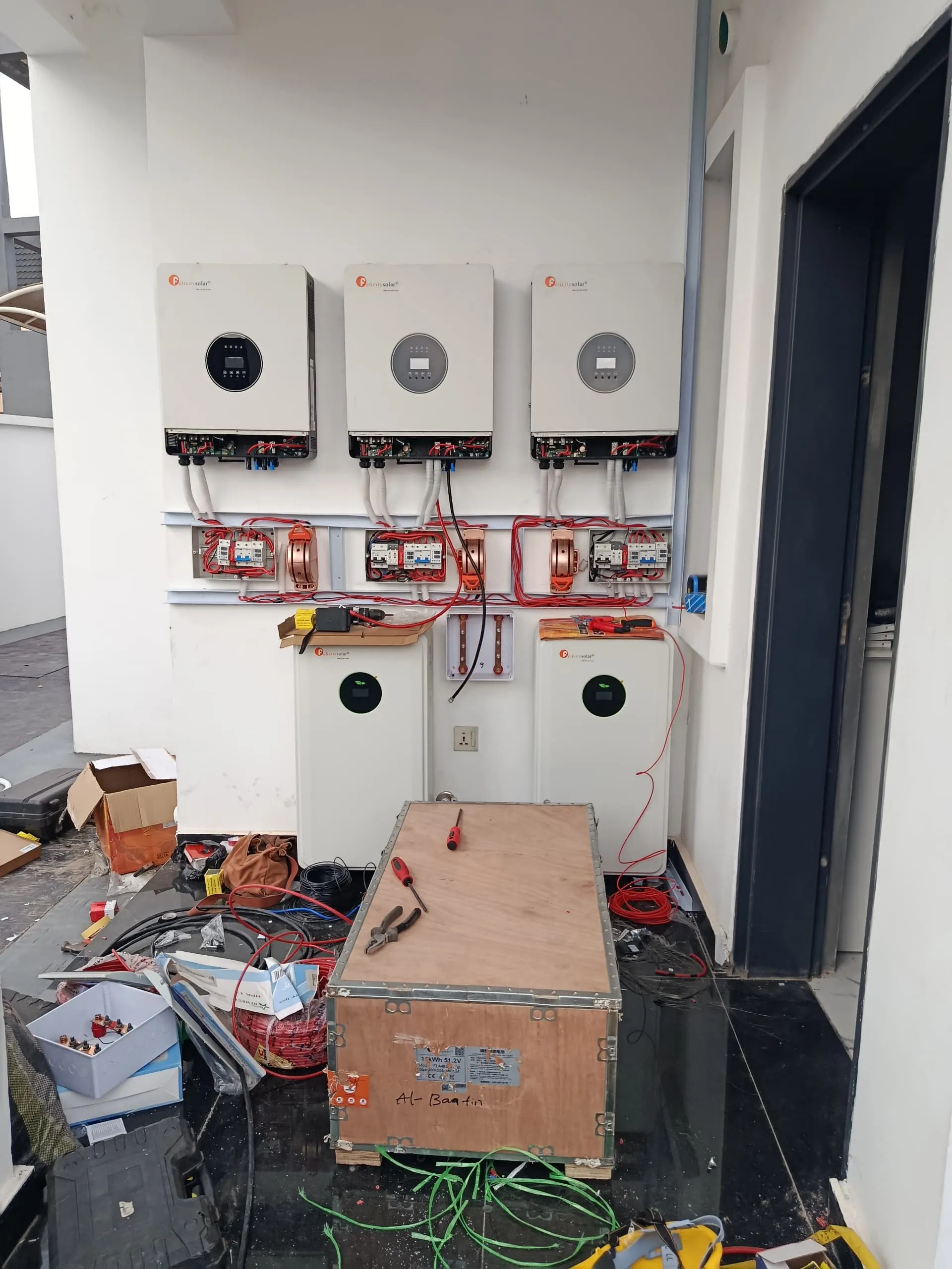 The inverter wall part-way through installation, cabling still being run between the units.