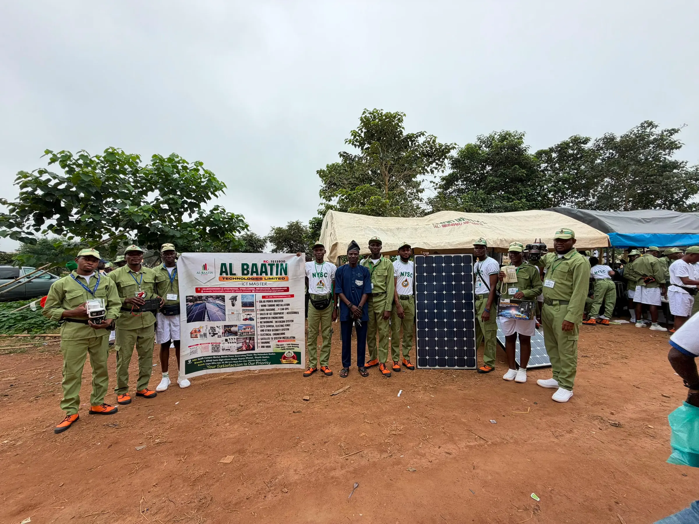 The Al-Baatin stand at NYSC orientation camp, with a Al-Baatin banner and a solar panel on display.