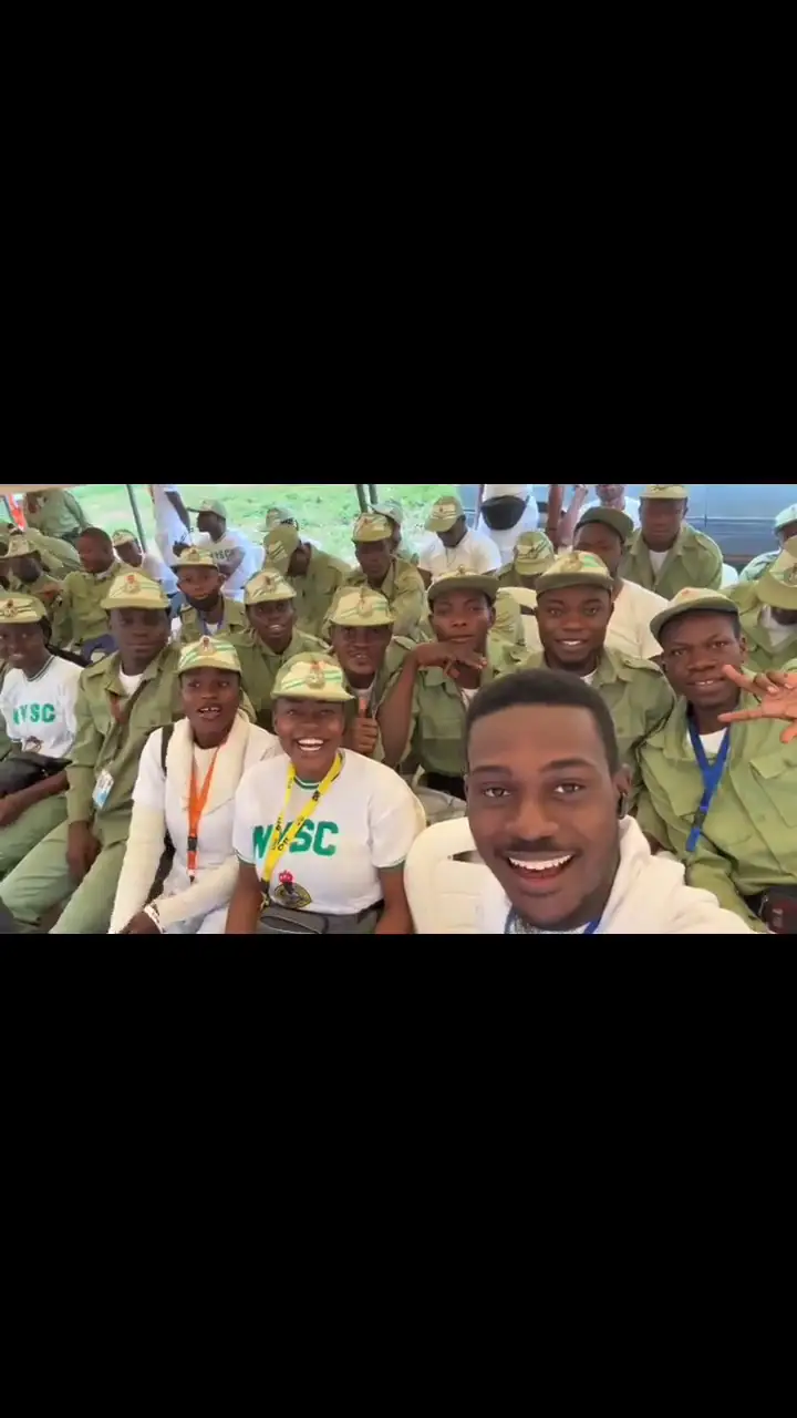 A walk through the camp stand with corps members gathered around.
